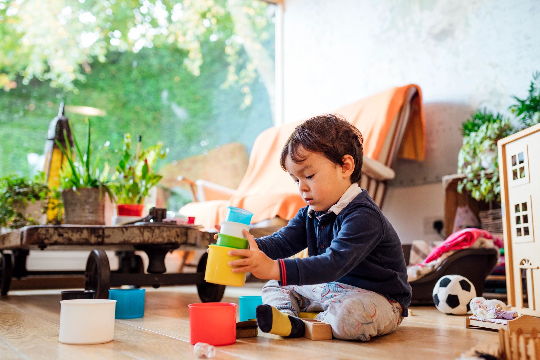 Child enjoying dinosaur toys at home
